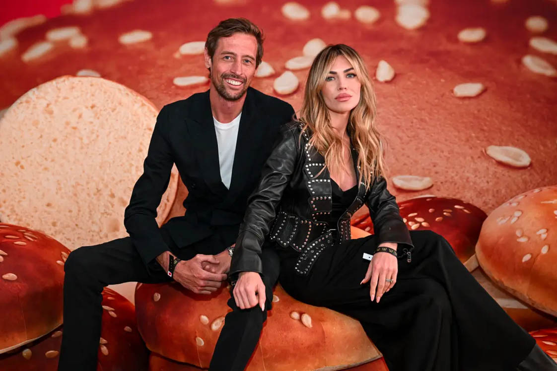 Peter Crouch and Abbey Clancy sitting on a burger