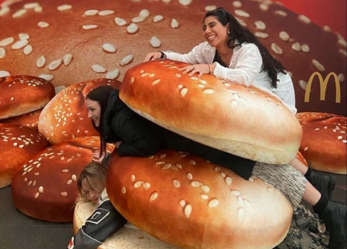 Visitors playing with giant Big Mac buns