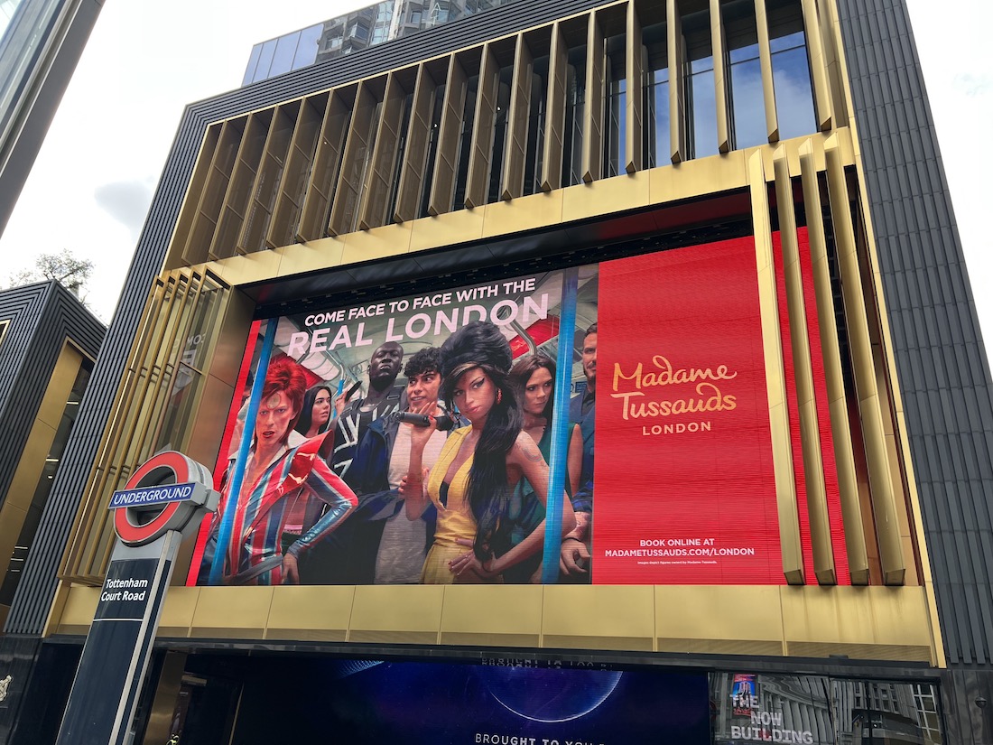 Amy Winehouse and other Madame Tussauds figures on the screens at Outernet